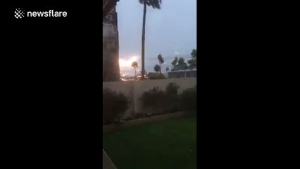 Power lines spark as trees fall during Cyclone Winston