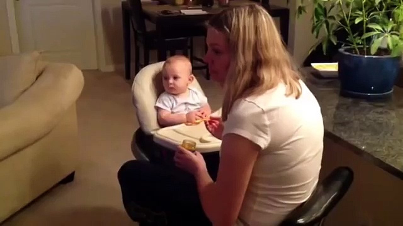 Baby uses overwhelming cuteness to get mom's attention