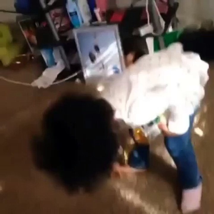 Girl spills juice on carpet