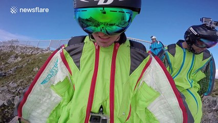 Man takes extreme selfie while wing suit flying
