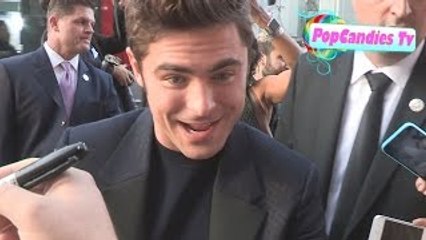 Zac Efron takes selfies while greeting fans at We Are Your Friends Premiere in Hollywood