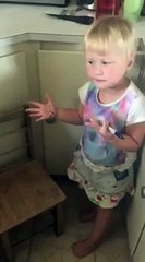 Little girl draws zebra stripes on sister