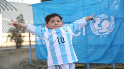 After making a soccer jersey out of a plastic bag, boy gets real thing