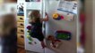 Little Girl Scales Refrigerator for Gummy Bears