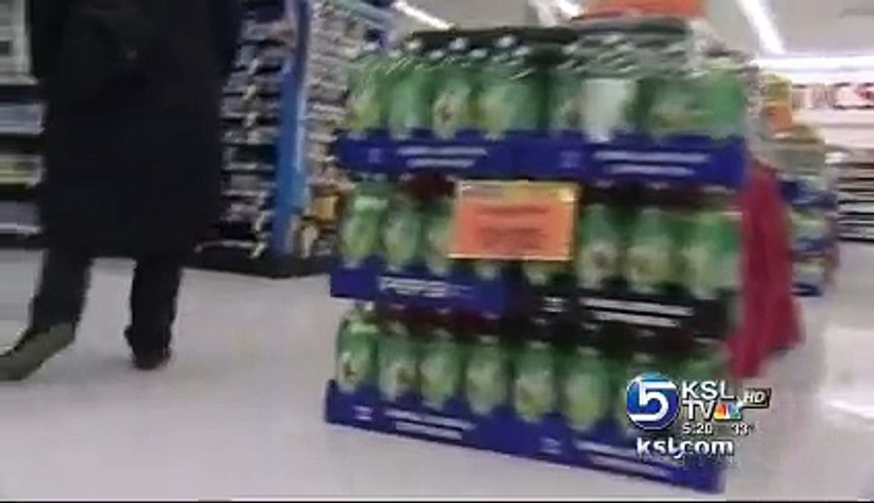 Furry thief , DOG shop lifting, grabs Christmas present out of grocery store aisle