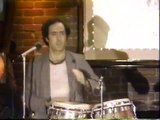 Andy Kaufman does his laundry on stage and plays the bongos