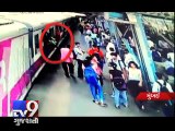 Mumbai - 20-year old leans out of train, bangs into traffic pole  - Tv9 Gujarati