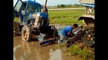 awesome tractor stuck in mud, modern agriculture stuck in mud, extreme tractor stuck in mu