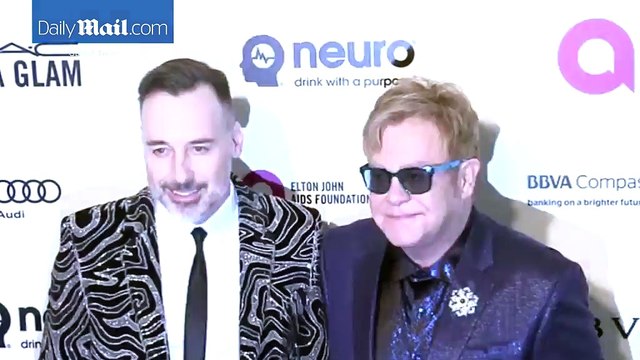 Elton John and David Furnish loved up at Oscar viewing party