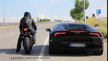 تحدي أسطوري بين لامبورغيني هوريكان ودراجة 14' CBR 1000RR