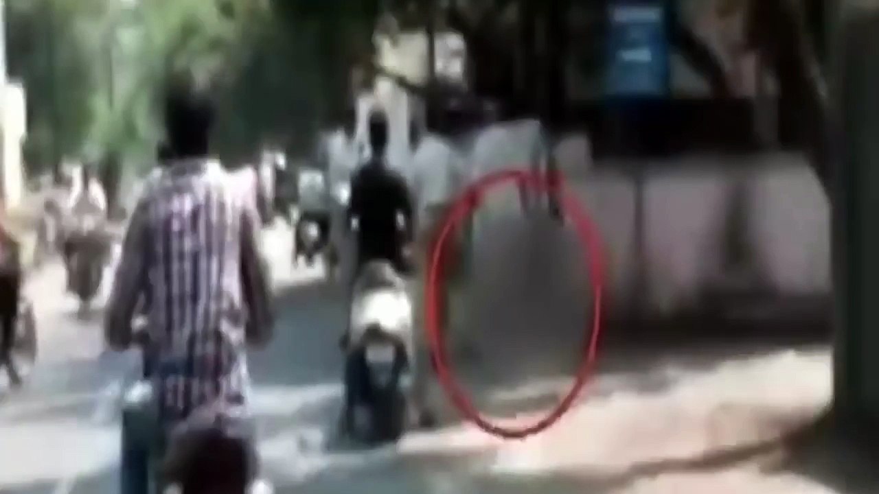 Shocking moment husband is seen carrying his wifes severed head in India