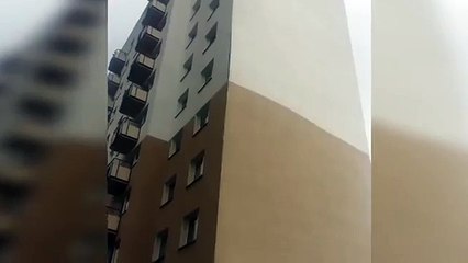 Strong winds rip facade