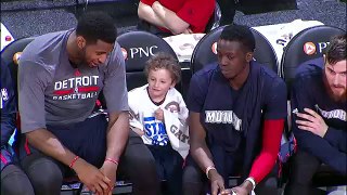 Andre Drummond Sits With A Young Fan On The Bench