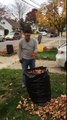 Dad demonstrates best possible way to bag leaves