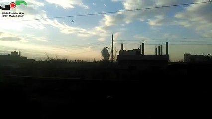 ‫حمص 12 2 2016 الدخان المتصاعد جراء الغارات الروسية على بلدة الدار الكبيرة‬‎