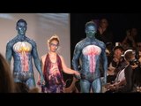 Down teen and bionic model walk at fashion week