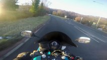 Motorcycle Driver hits Rear of a Car blinded by the Sun riding in Wales