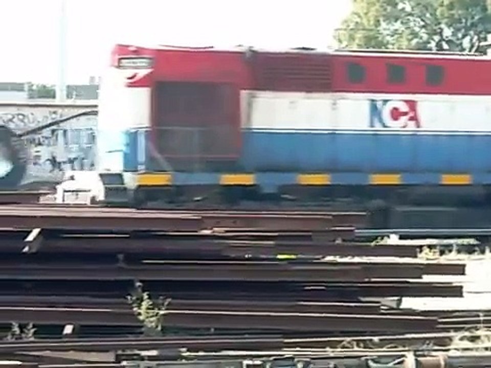 Tren de NCA "Bobinero" con Loc. Alco RSD 16 8232 en Retiro.-