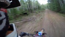 Bikers have a close call with a bear crossing a trail