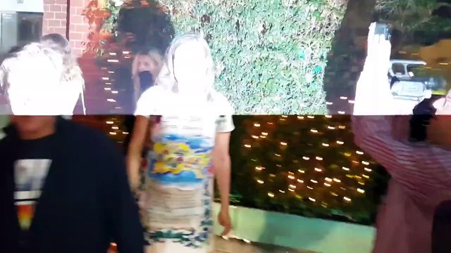 Actress Jennifer Tilly chats with paparazzi outside Beverly Hills restaurant