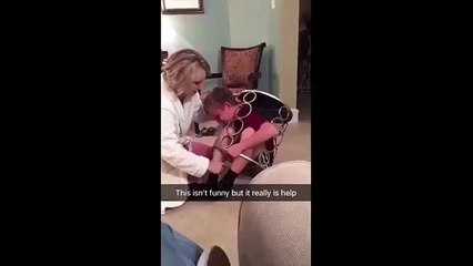 Kid manages to get stuck in a table