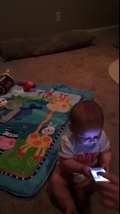 funny baby using mobile