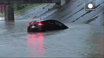 TV reporter saves driver sinking in Texas floodwaters