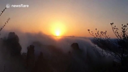 Rain in China causes 'cloud waterfall' to appear