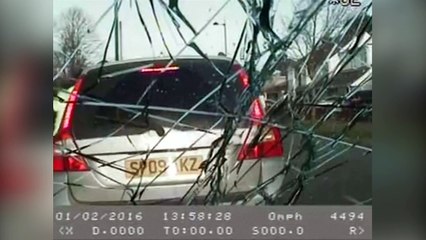 Dashcam video: Men throw bricks at a police car