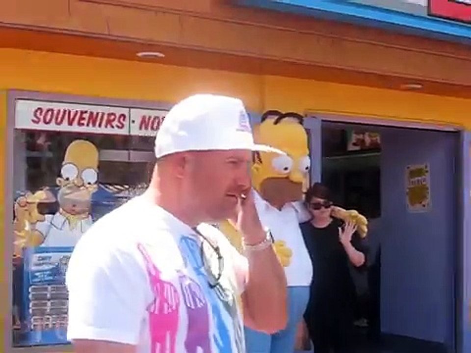 Homer, Marge, and Bart Simpson near the Simpsons Ride