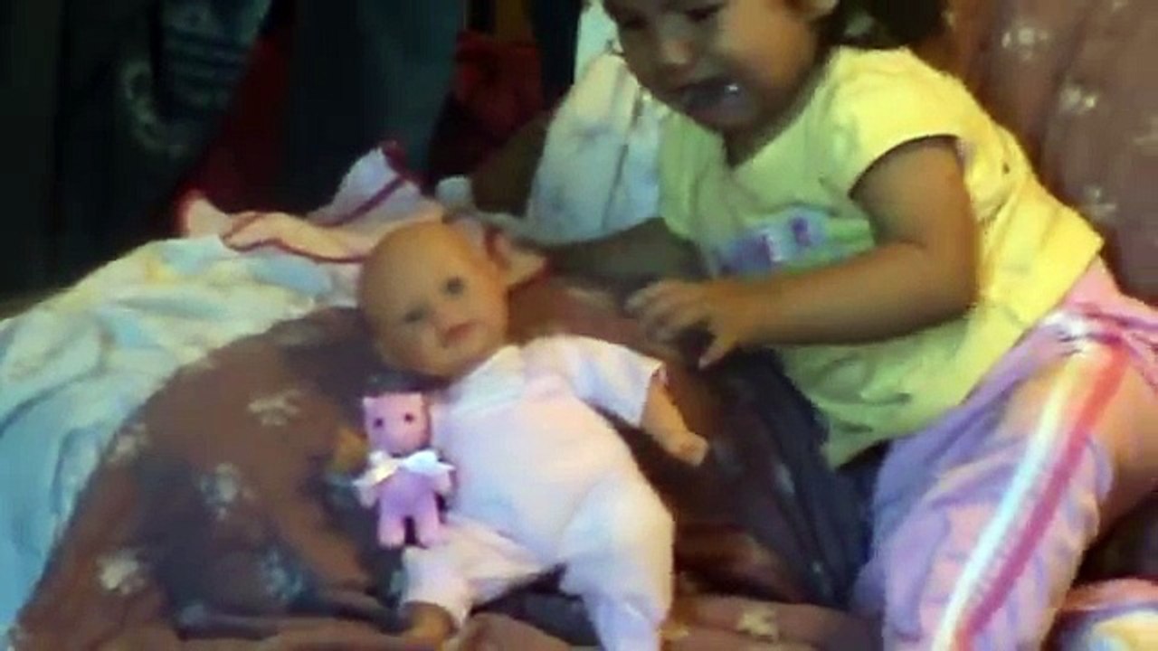baby afraid of doll