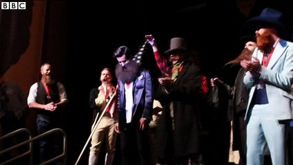 Beard championship winner celebrates with flowers - BBC News