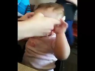 Baby with poor vision puts on glasses for the first time