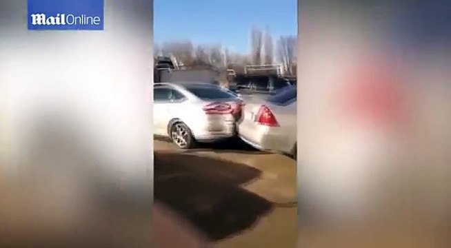 The moment drunk woman hits SEVENTEEN cars whilst trying to park