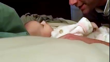 dad playing with his cute baby