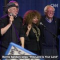Bernie Sanders sings This Land is Your Land with supporters at a rally