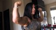 world fitness Beautiful Strong Woman flexing her big muscles