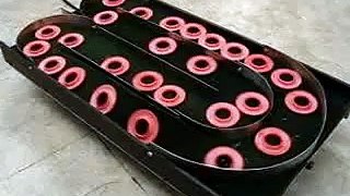 Vibratory Serpentine Conveyor by RoboShop Inc.