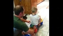 Dad Pushes Boy On Scooter, Puppy Pulls Him Back