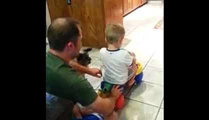 Dad Pushes Boy On Scooter, Puppy Pulls Him Back