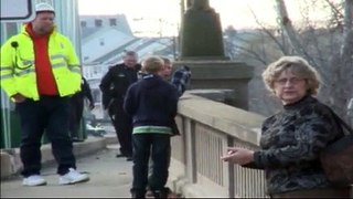 Does he jump? Cops close bridge as man contemplates suicide.
