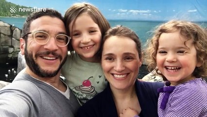 Kid grabs mum in awkward place during family photo