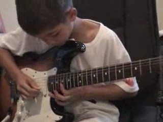 Kid playing the guitar  Zeppelin