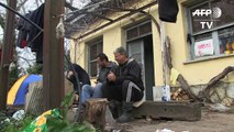 Refugees on Greek-Macedonia border sleeping in abandoned homes