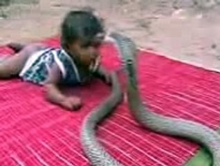 Child Plays With Snake Like A Toy