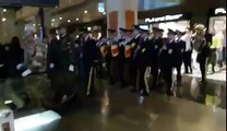 Military band surprises customers in a shopping mall