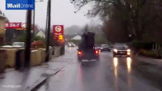 A person trying to move a sofa in the midst of Storm Desmond _ Daily Mail Online