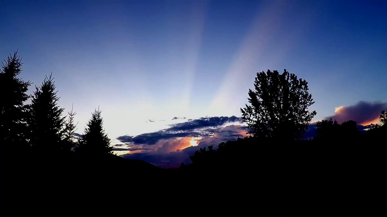 Rare sunlight rays streak across entire sky