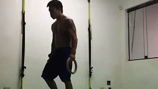 Man Works out Using Rings