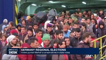 Voters punish Merkel's conservatives in state votes